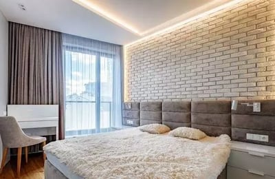 Long-term rental of a modern 3-room apartment in Wola (Warsaw) with a balcony and underground parking