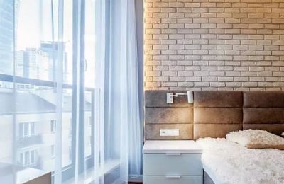 Long-term rental of a modern 3-room apartment in Wola (Warsaw) with a balcony and underground parking