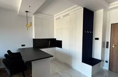 Long-term rental of a 40 m² 2-room apartment on Mariana Zdziechowskiego Street, Warsaw, Poland, in a new building with a balcony