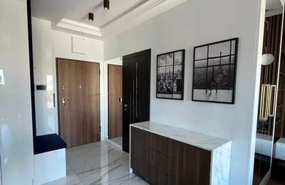 Long-term rental of a 40 m² 2-room apartment on Mariana Zdziechowskiego Street, Warsaw, Poland, in a new building with a balcony