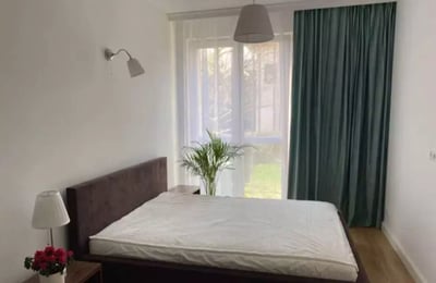 Long-term rental of a modern 50 m² 2-room apartment with a terrace in Zawady, Wilanów, Warsaw